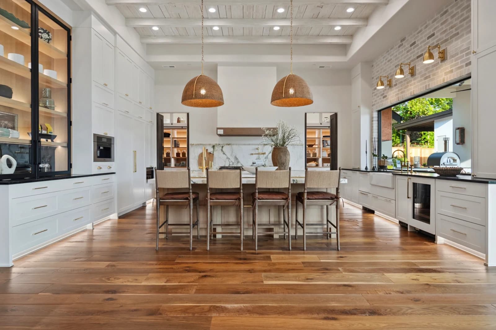 Bright, modern Portland kitchen styled by Greylyn Wayne — island, rattan pendants, and natural wood floors