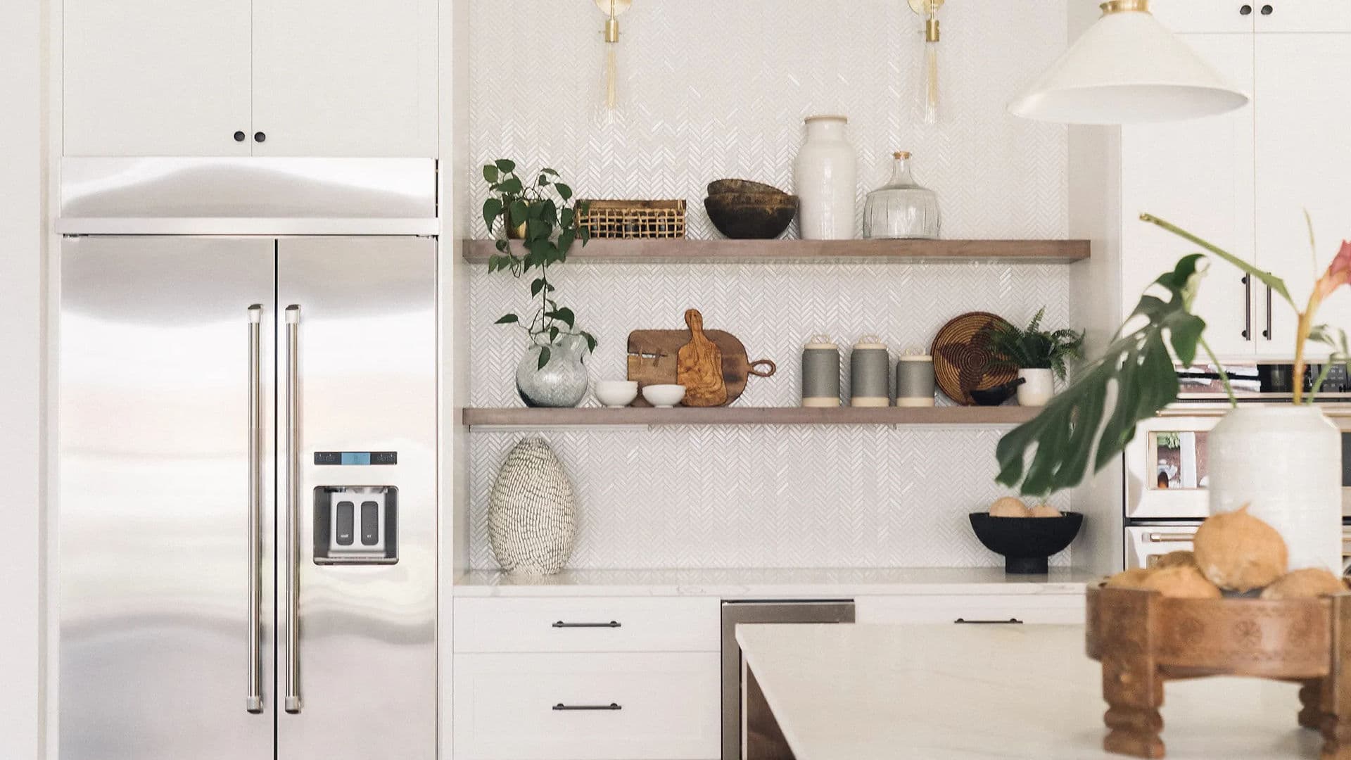 Beautifully staged Portland kitchen by Greylyn Wayne — bright white cabinetry with natural wood and gold accents