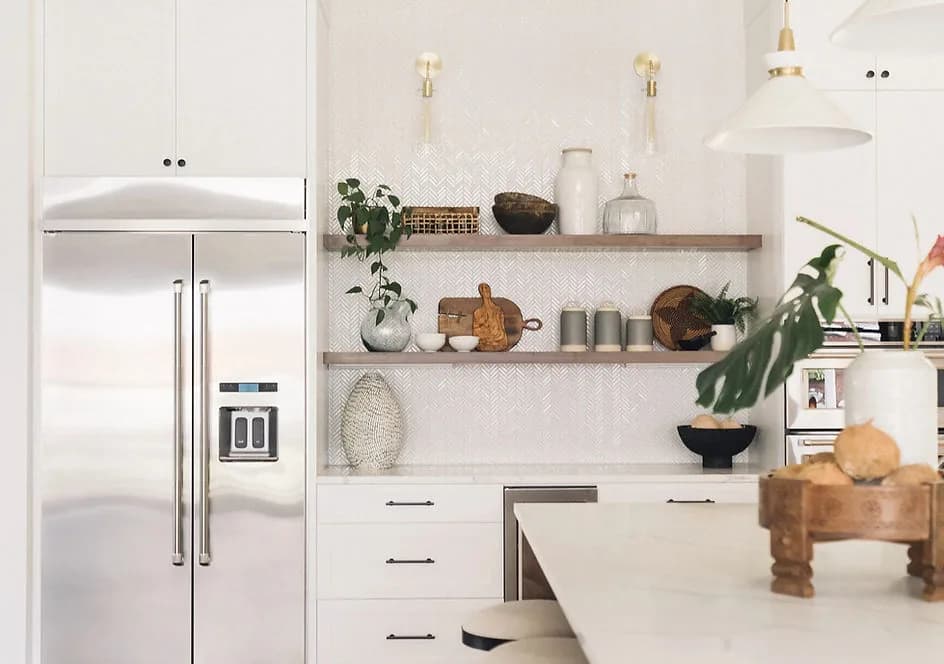 Interior design by Greylyn Wayne — modern white kitchen with open shelving and natural wood accents in Portland home